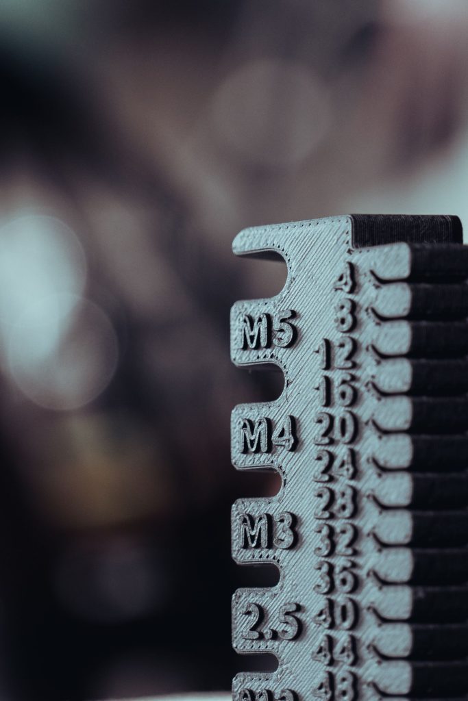 Close-up of a size gauge with M3, M4 and M5 markings
