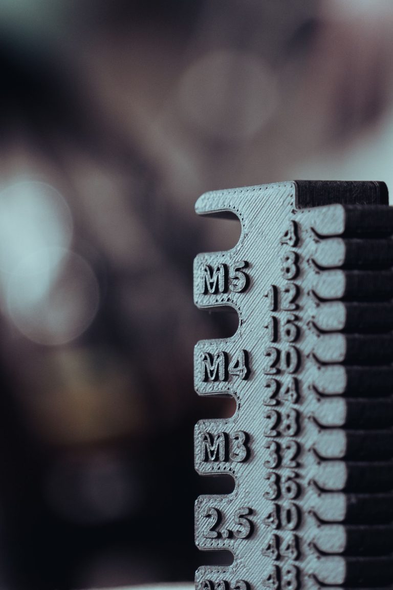 Close-up of a size gauge with M3, M4 and M5 markings